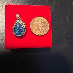 14 k gold, diamond, and opal pendant